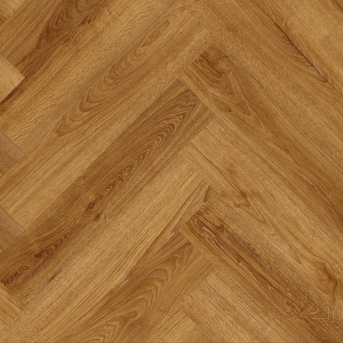 A close-up view of a herringbone wood flooring sample, showing the grain and texture of light brown oak planks arranged in a herringbone pattern.